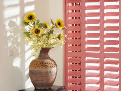 A bright coloured plantation window shutter, demonstrating you don't just have to select a standard white finish.